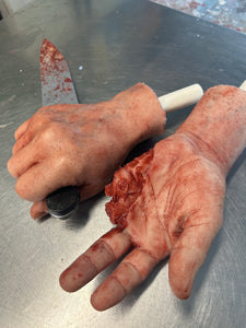 Pair of hands with knife