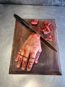 Cutting board with magnetic fingers