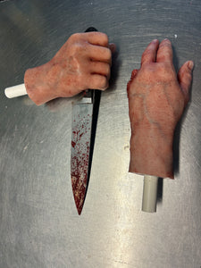 Pair of hands with knife