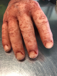 Severed male hand